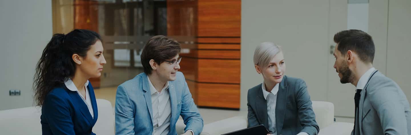 four young people sitting down